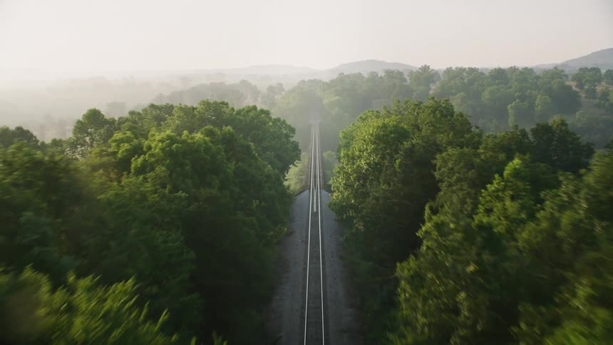 A train track is on the long bridge