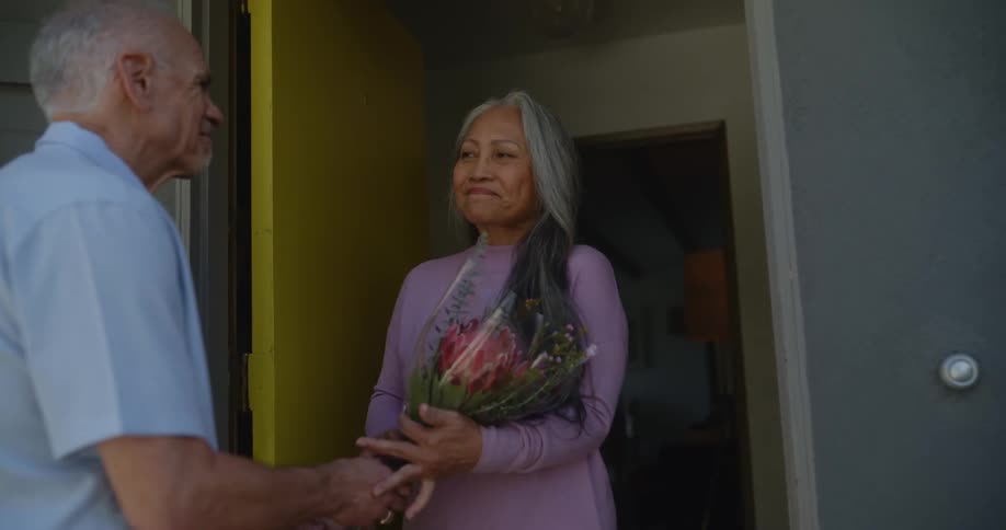 Man giving a woman roses