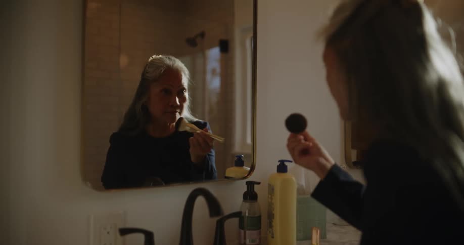 A clip of an asian woman making up