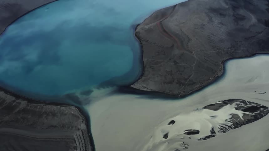 Aerial panorama of blue crater lake in the mountains