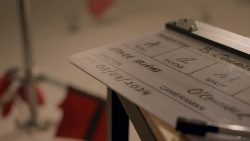 A clapperboard sitting on a desk
