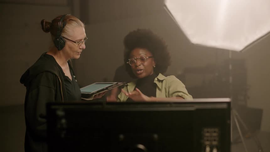 A woman directing the making of a film gets excited