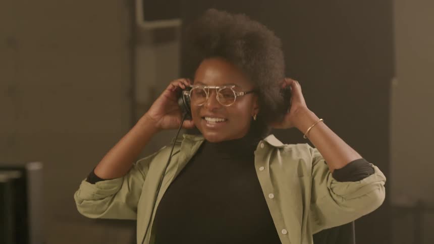 Woman is excited and sitting at a computer desk