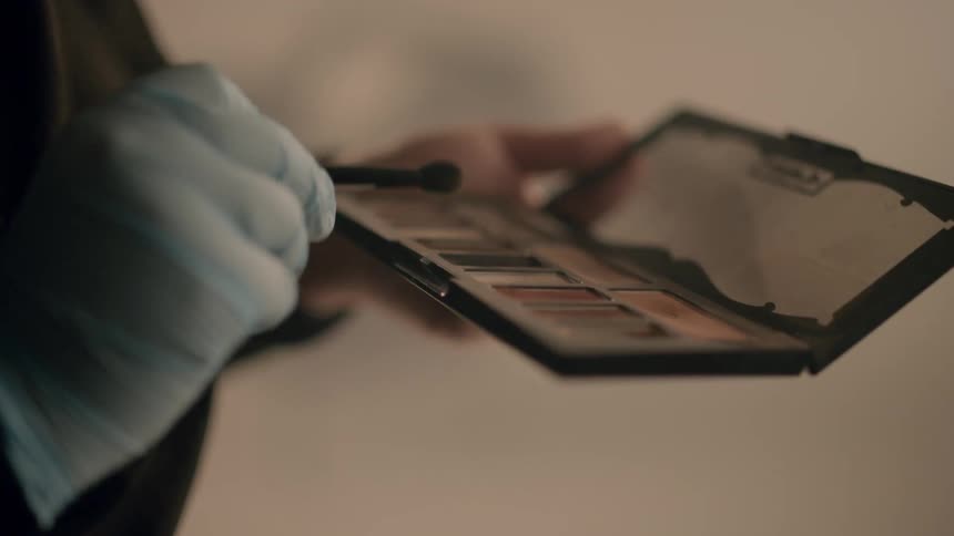 Footage of a makeup artist at work