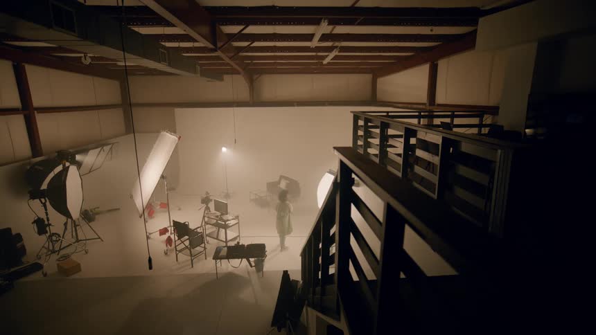 A clip of a lady in a studio room