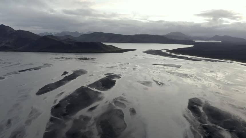 A frozen arctic landscape with clouds in the horizon