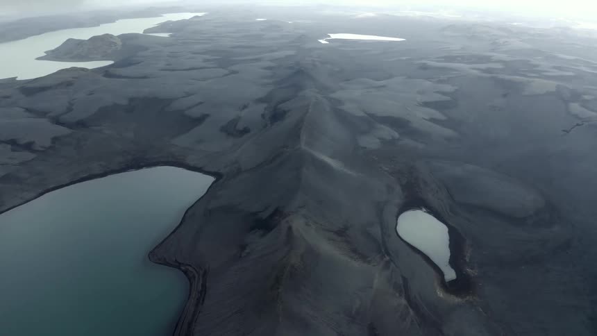 Aerial view of a natural environment with craters in rocks covered by water
