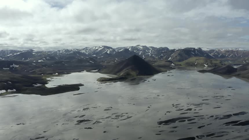 Frozen water meets a mountainous coastal area