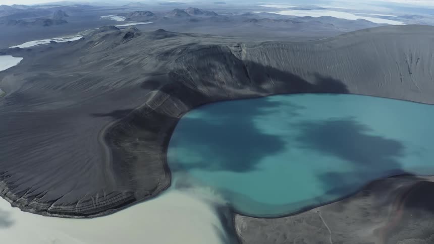 A crater lake fed by a glacier
