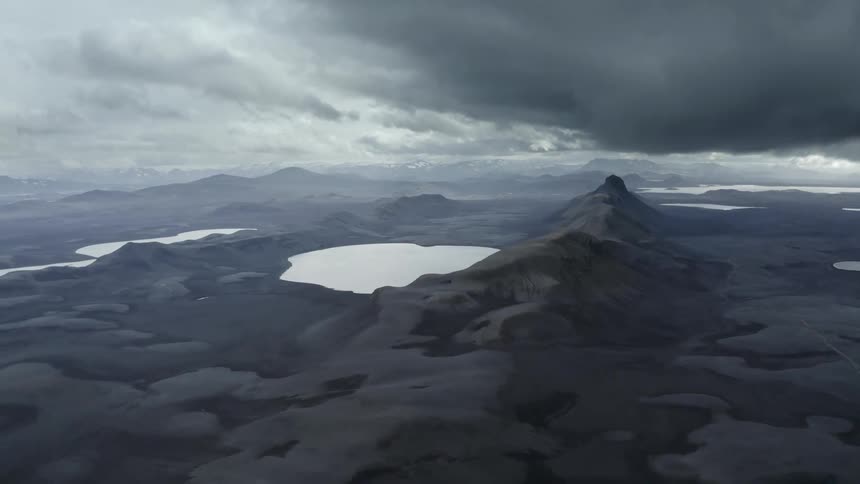 Mountains are covered in snow on a cloudy day