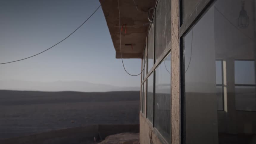 A cable dangles outside of a house