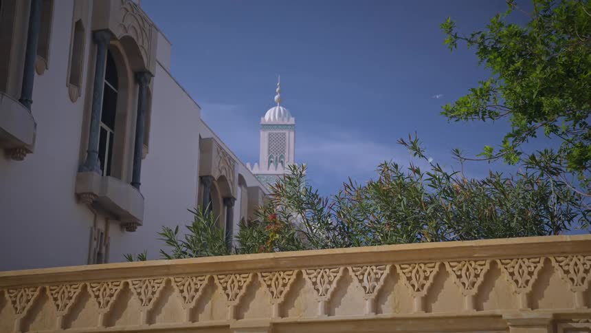 A clip of a mosque tower in a community