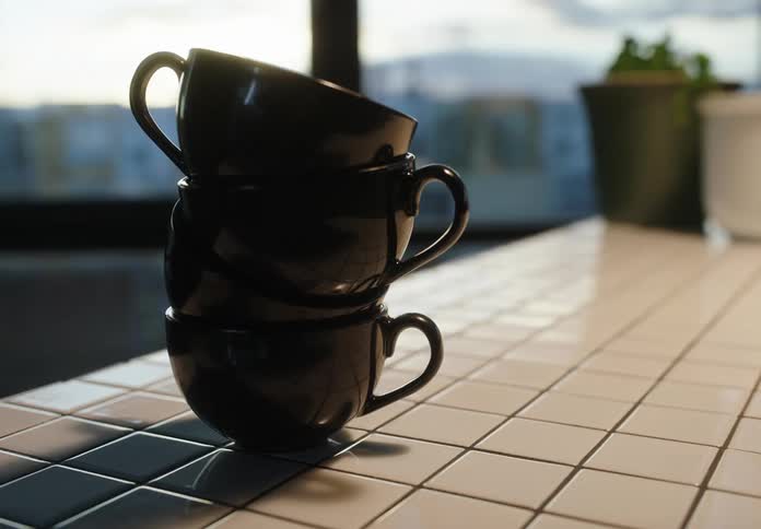 Porcelain mug one on top of the other on a counter