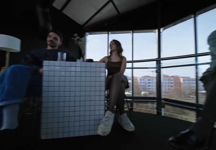 People sitting on sofa and chairs around in the office in a building