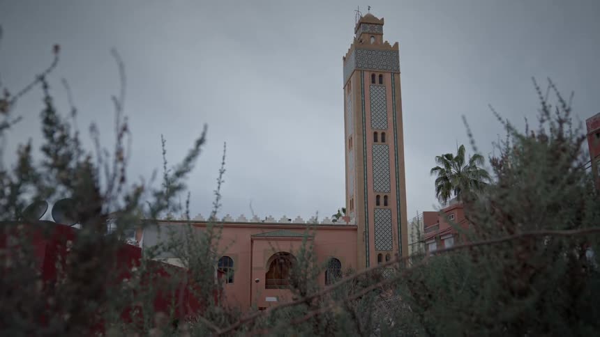 A mosque looms over the area