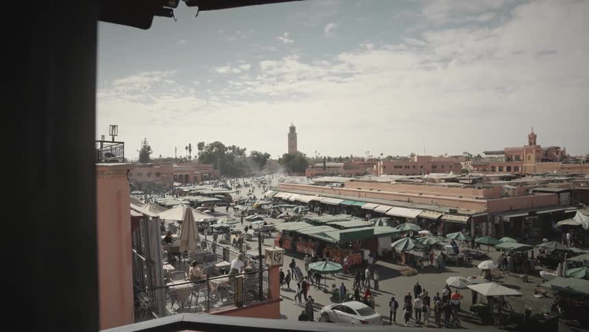 A crowded outdoors market on a middle east city Marrakesh Djemaa el Fna