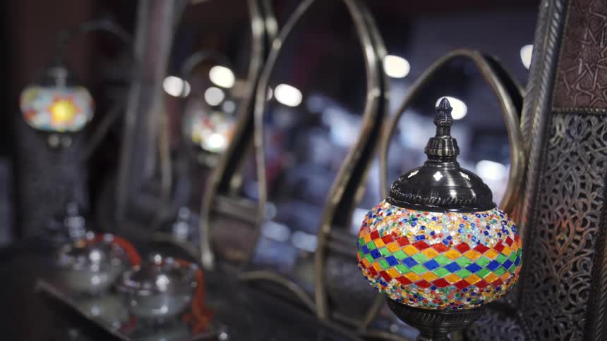 A brightly decorated lamp on a table