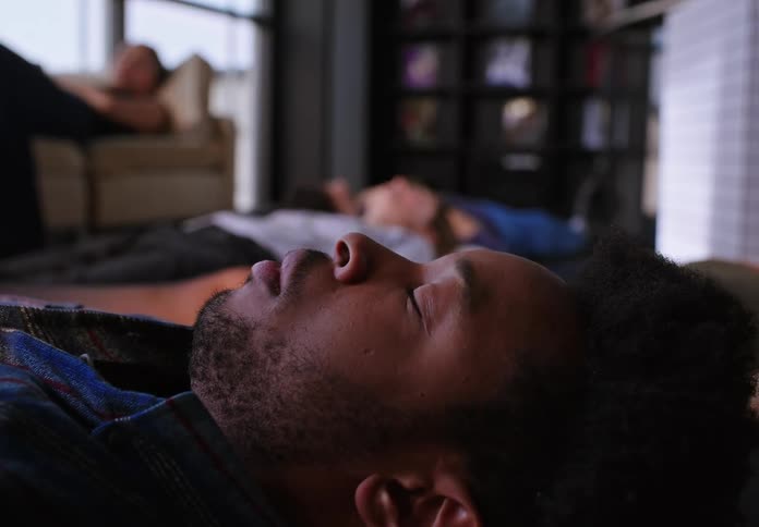 A group of coworkers taking a nap in the office