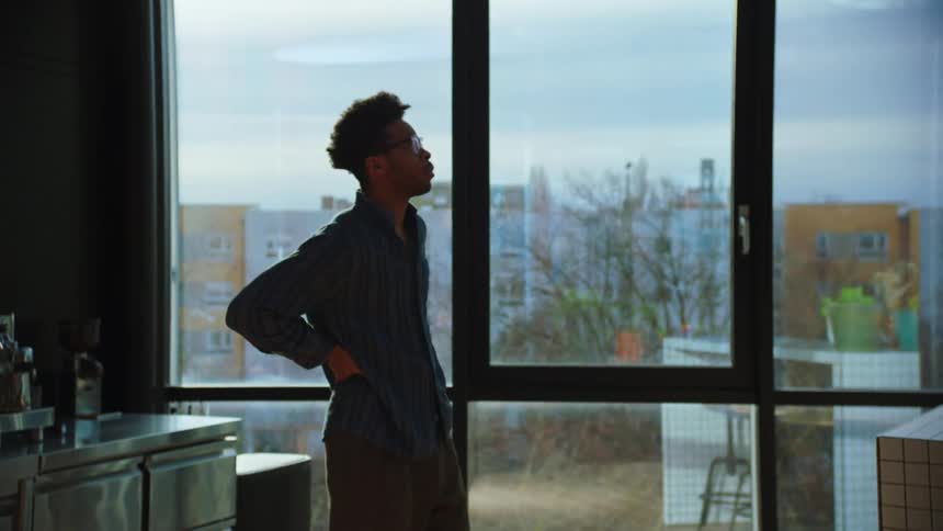A man circling around thinking at the office