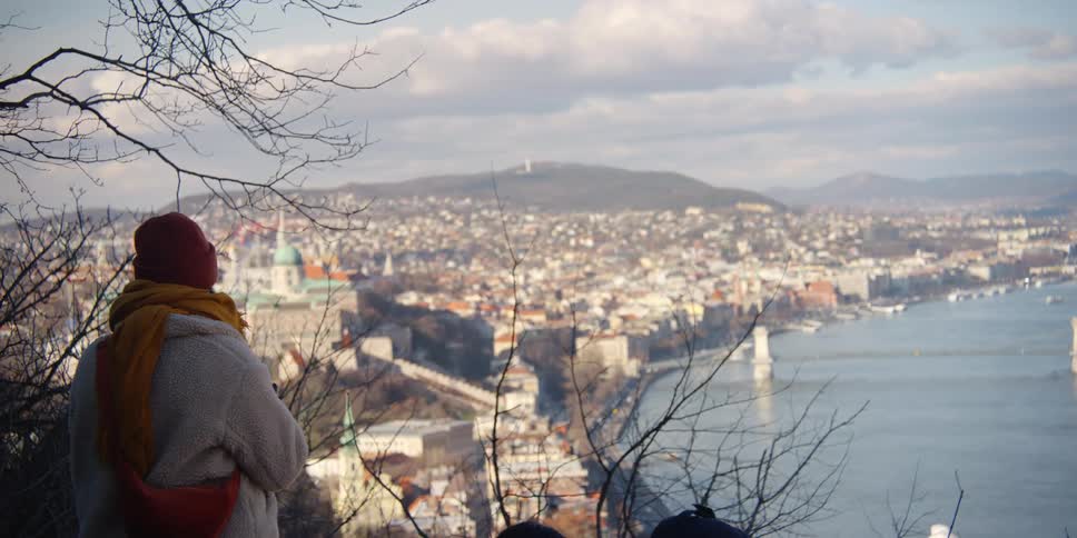 Tourist taking a photo of Budapest along Danube River