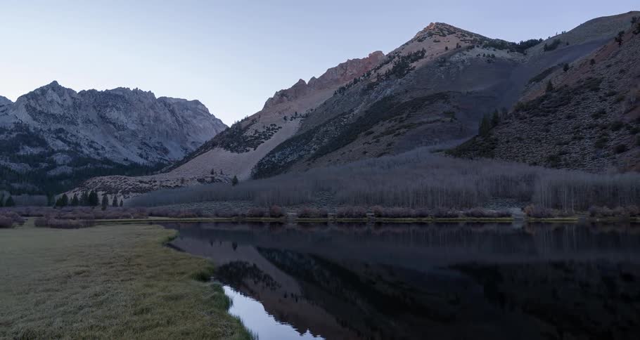 A large lake by large mountains