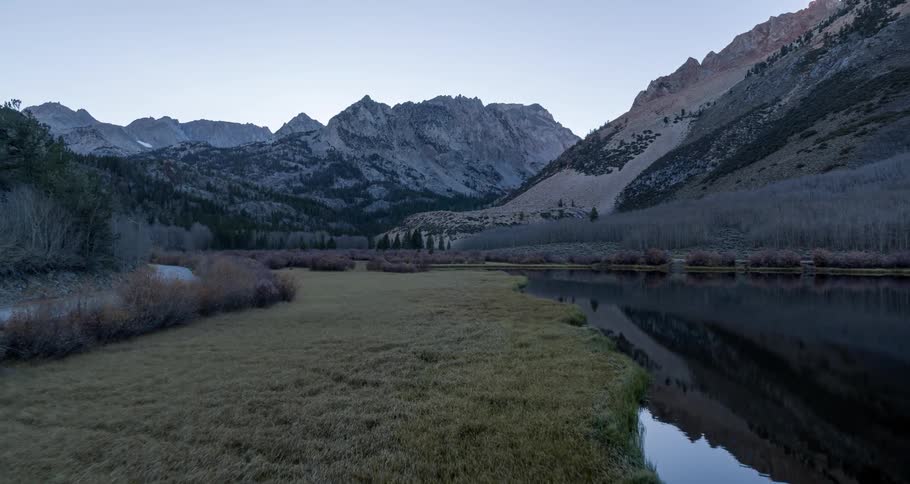 A stream runs past the mountains