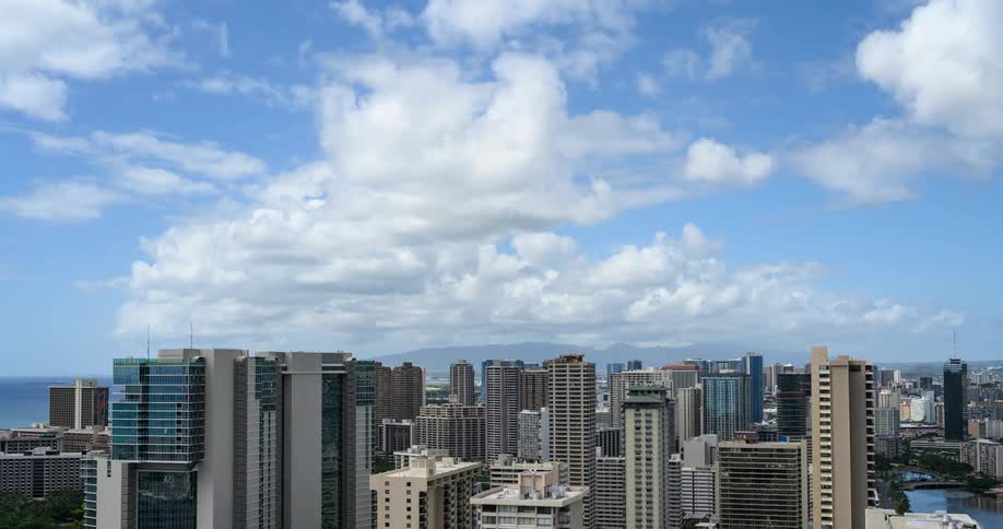 Clouds flow over the buildings