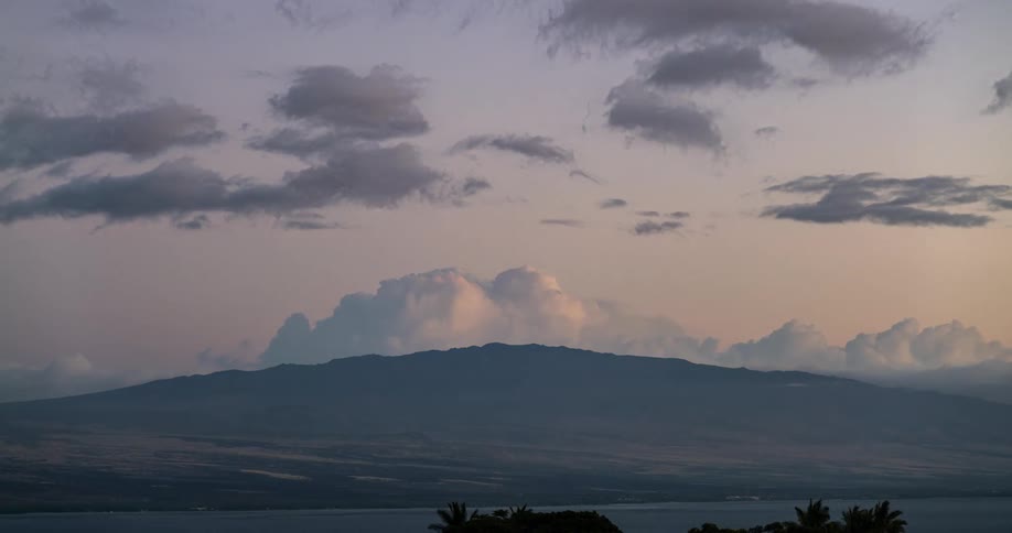 Clouds roil over a mountain