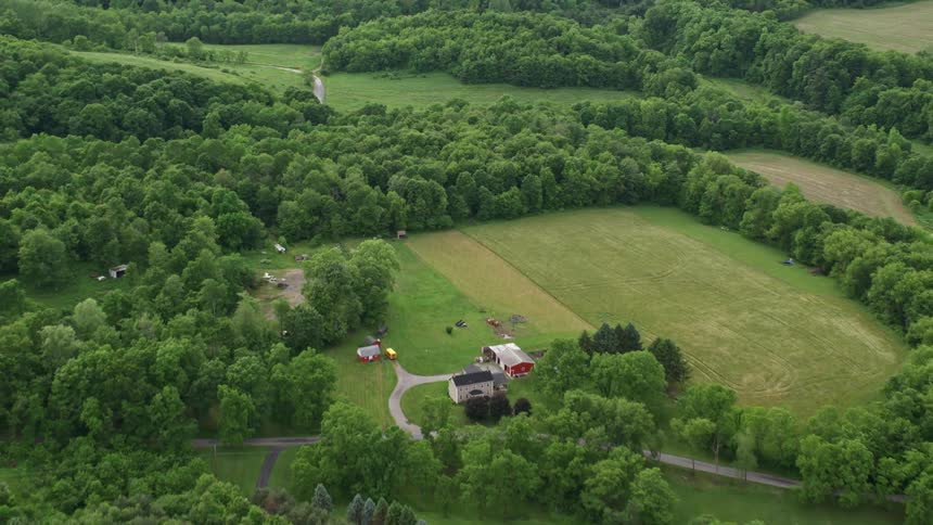 Aerial panorama of houses in rural locations surrounded by greenery