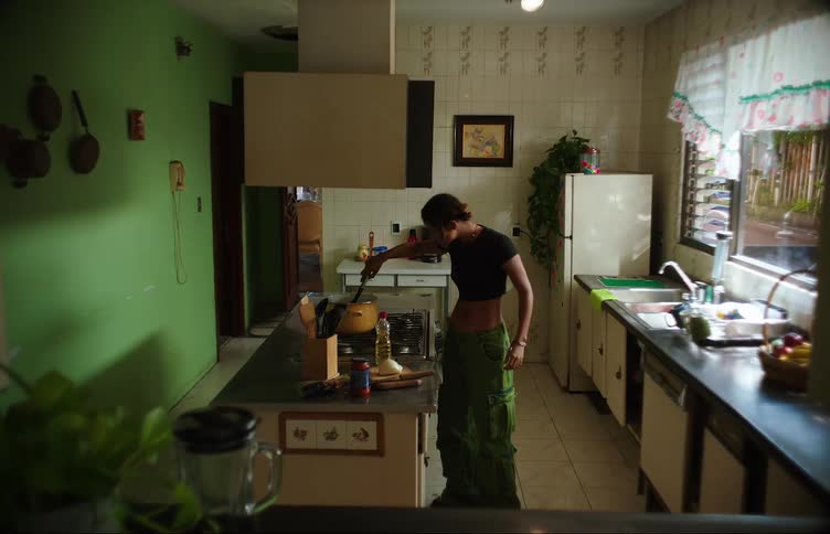 Woman in the kitchen bored cooking pasta
