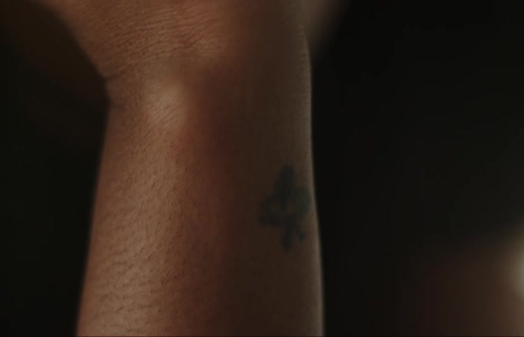 Small tattoo on the wrist of a young woman