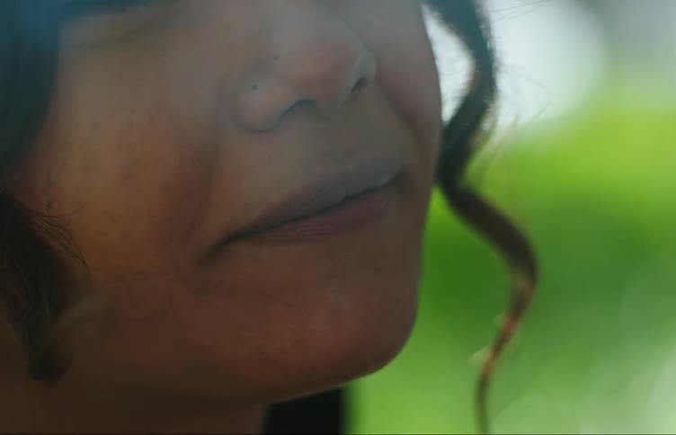 Face of a young woman smoking
