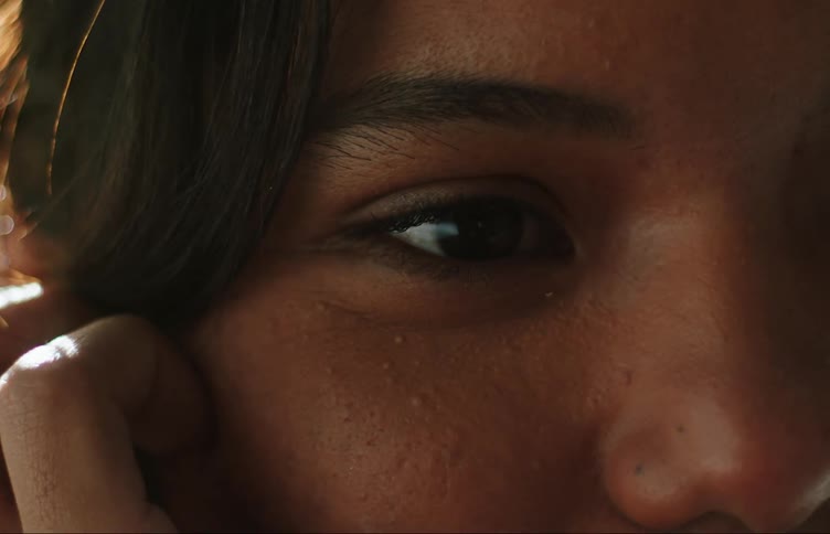 Closeup on the face and eyes of a young woman