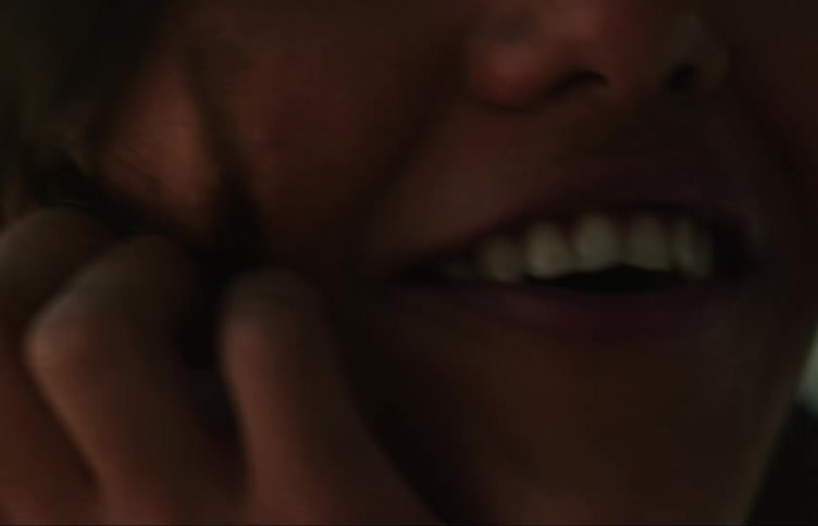 A woman is laughing and talking