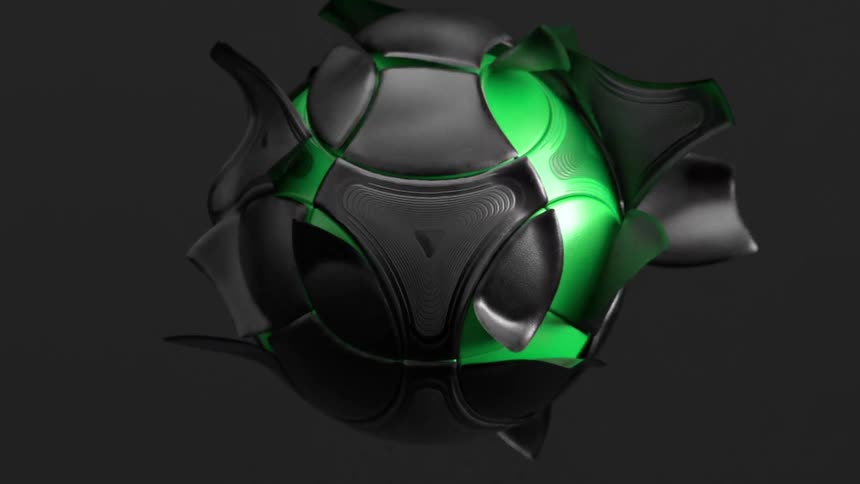 A black soccer ball and its surface is expelled away and the ball inside is green