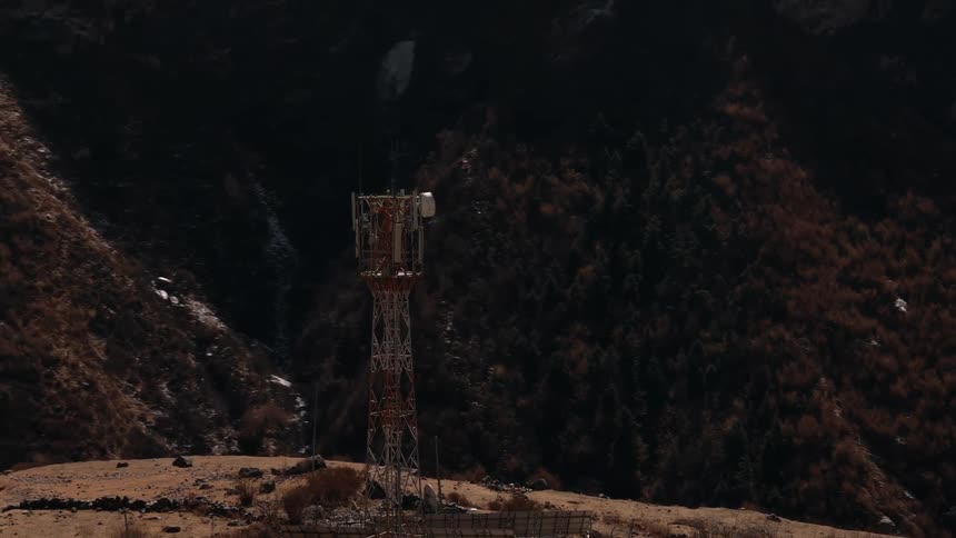 Aerial view of a cell phone tower on a mountaintop