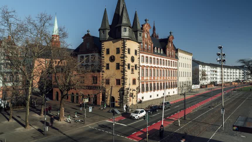 Scenery of a street with vehicle and pedestrian traffic in a city with an urban area