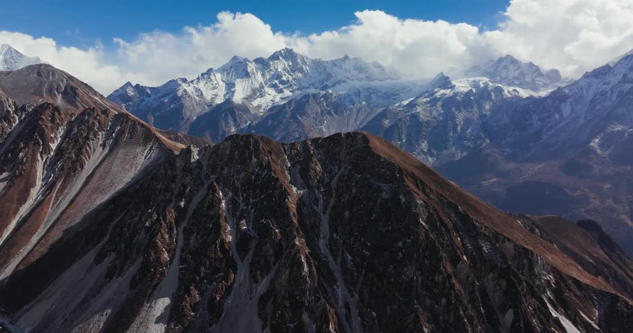 Aerial view of the barren slopes of a mountain on a clear day