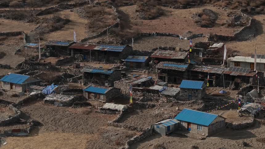 Aerial panorama of a village with a simple house on a mountain plateau