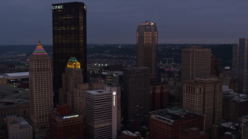Aerial scenery of skyscrapers in a metropolis with the purple sky dawning