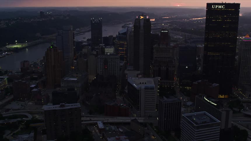 The city is dark at sunset
