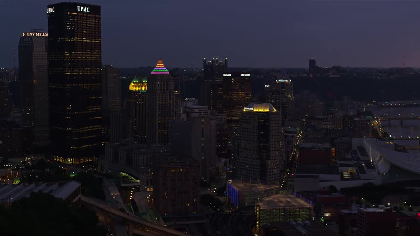 Panorama of a metropolis and commercial and residential buildings in a dusk purple sky
