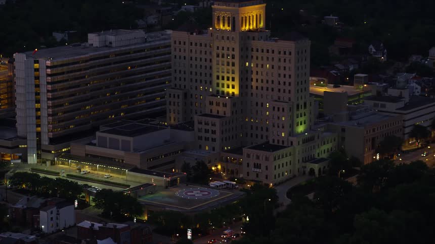 Aerial aerial scenery of a metropolis with residential and commercial buildings at night