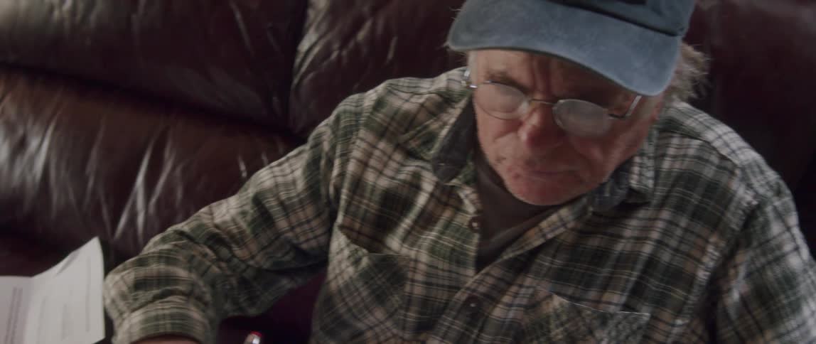 A man is looking through papers