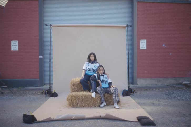 Two young women pose for photography