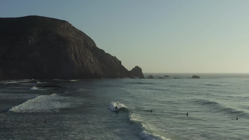 Panorama of a beach with rocky coast in a morning