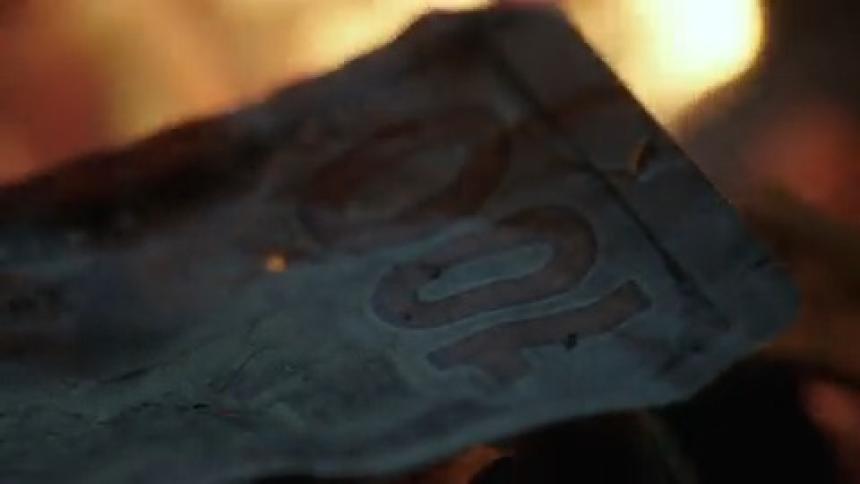 Extreme close up of a banknote on fire