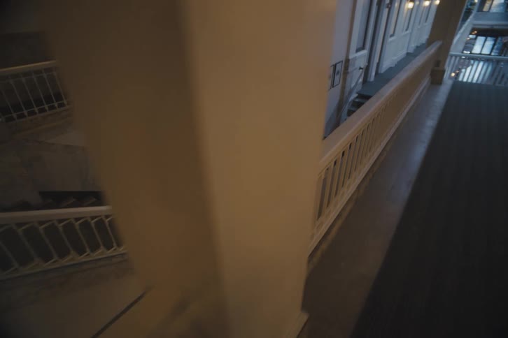 Two people run down the stairs together