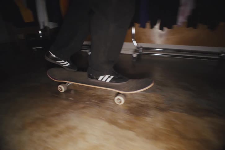 Skateboarding inside a closed clothes store