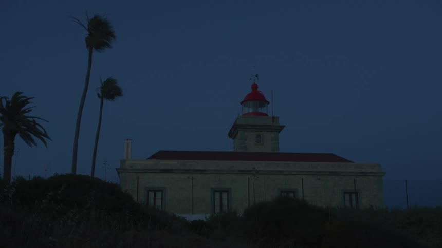 An old lighthouse turns itself on at night
